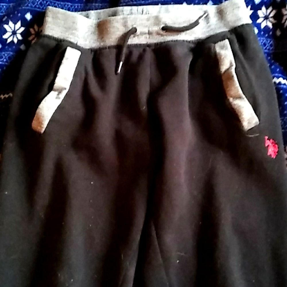 Black, gray, and red string sweat pants.